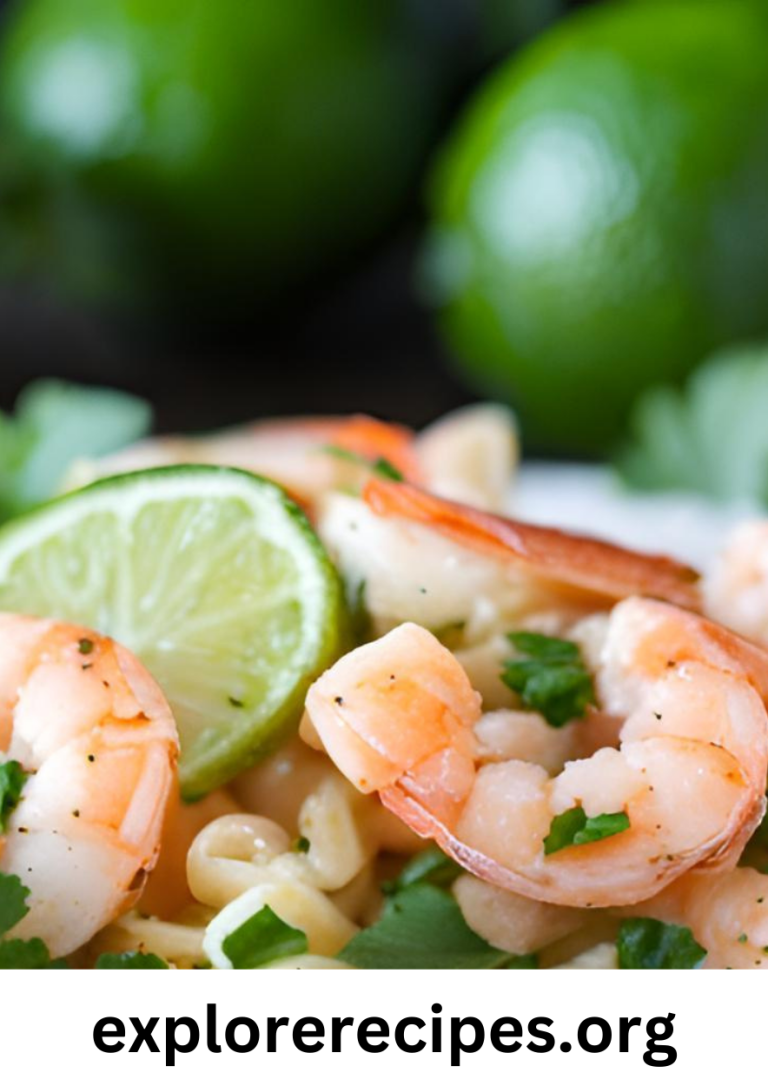 A vibrant shrimp cilantro lime pasta salad with avocado, cherry tomatoes, and fresh cilantro, served in a large white bowl.
