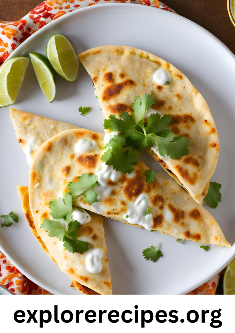 Close-up of a crispy, golden-brown quesadilla filled with melted cheese, roasted corn, and crumbled cotija cheese, drizzled with cumin lime crema and garnished with fresh cilantro and lime wedges.